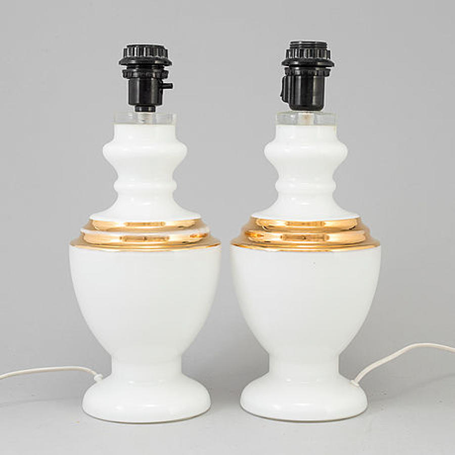 A pair of white opaline glass table lamps