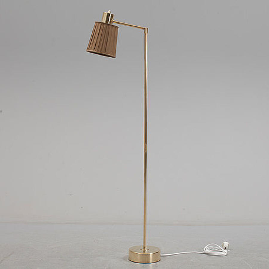 A Swedish brass swing arm standard lamp
