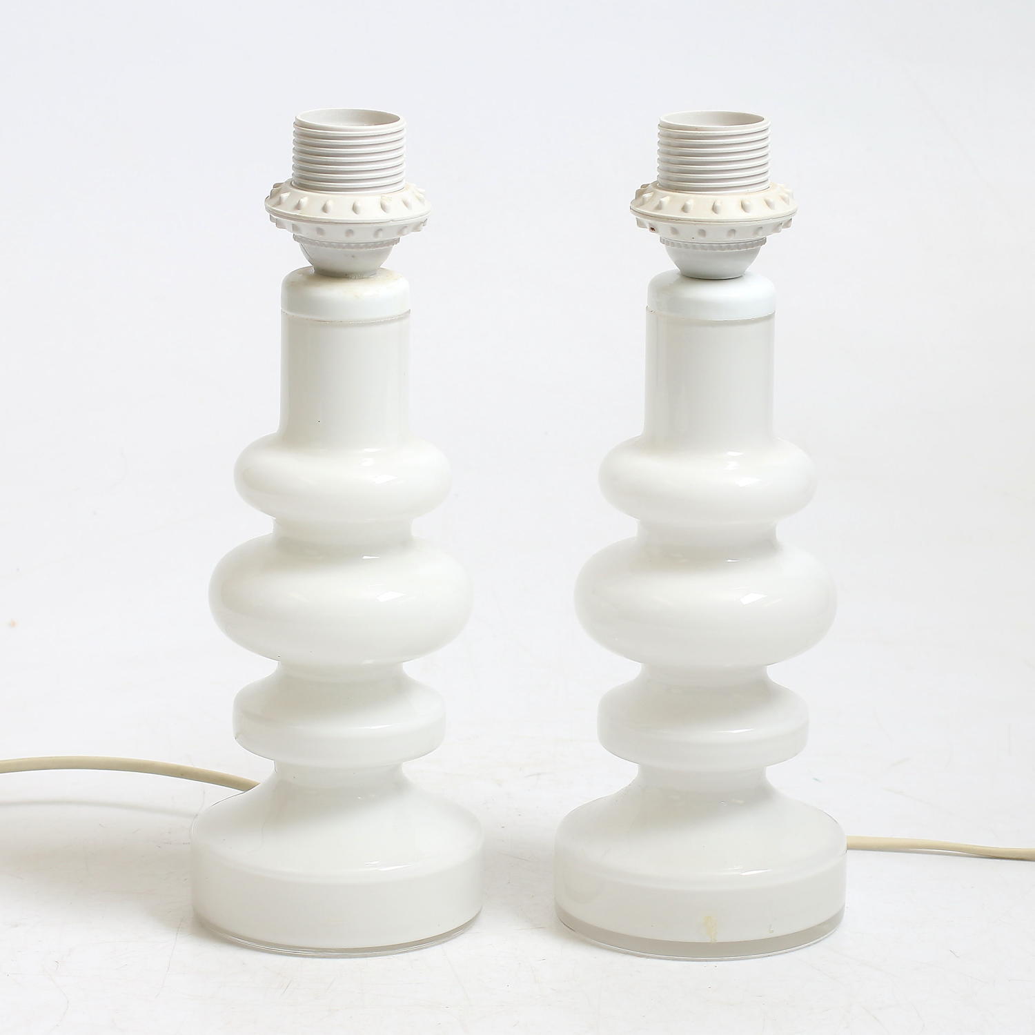 A pair of Swedish white glass table lamps